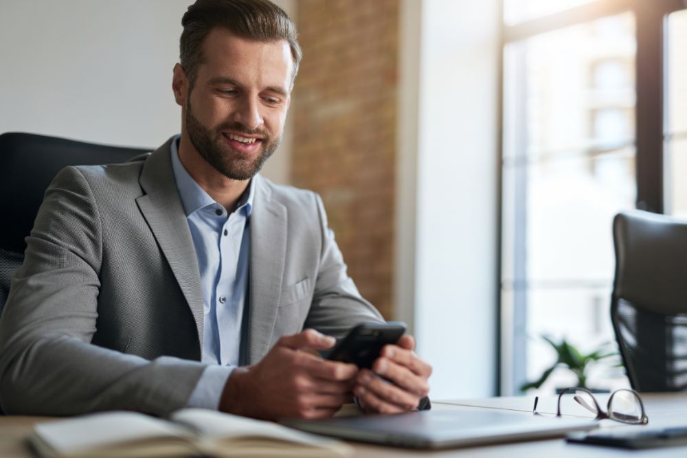 Business Company Employee Smiling At His Workplace 9WTR46Q