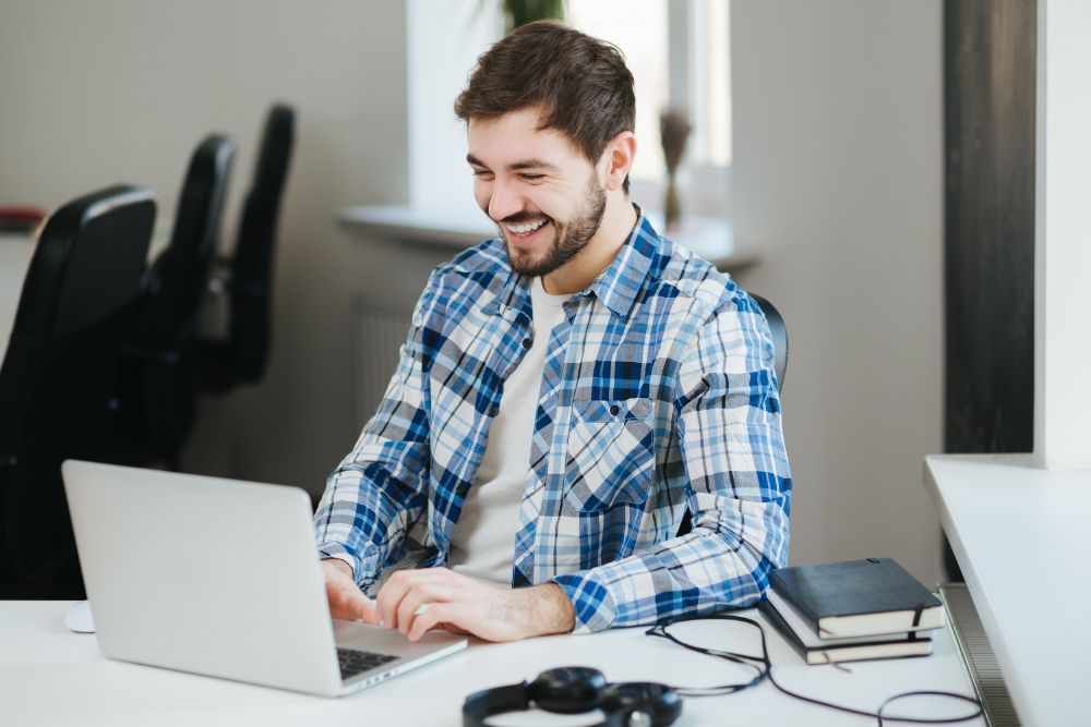Happy Man Working On Laptop TZADSEC
